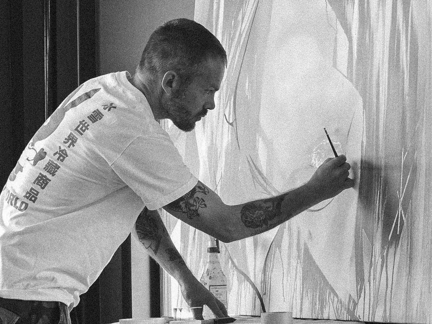 Ben Tour painting in his studio